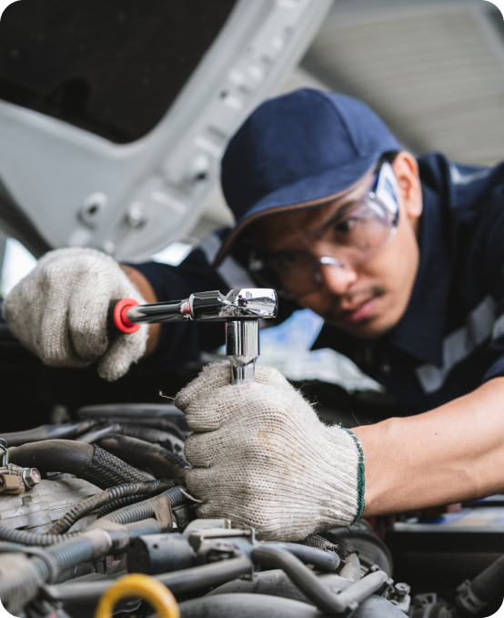 Service technician using Automobile ERP Solution for vehicle maintenance and repair tracking.